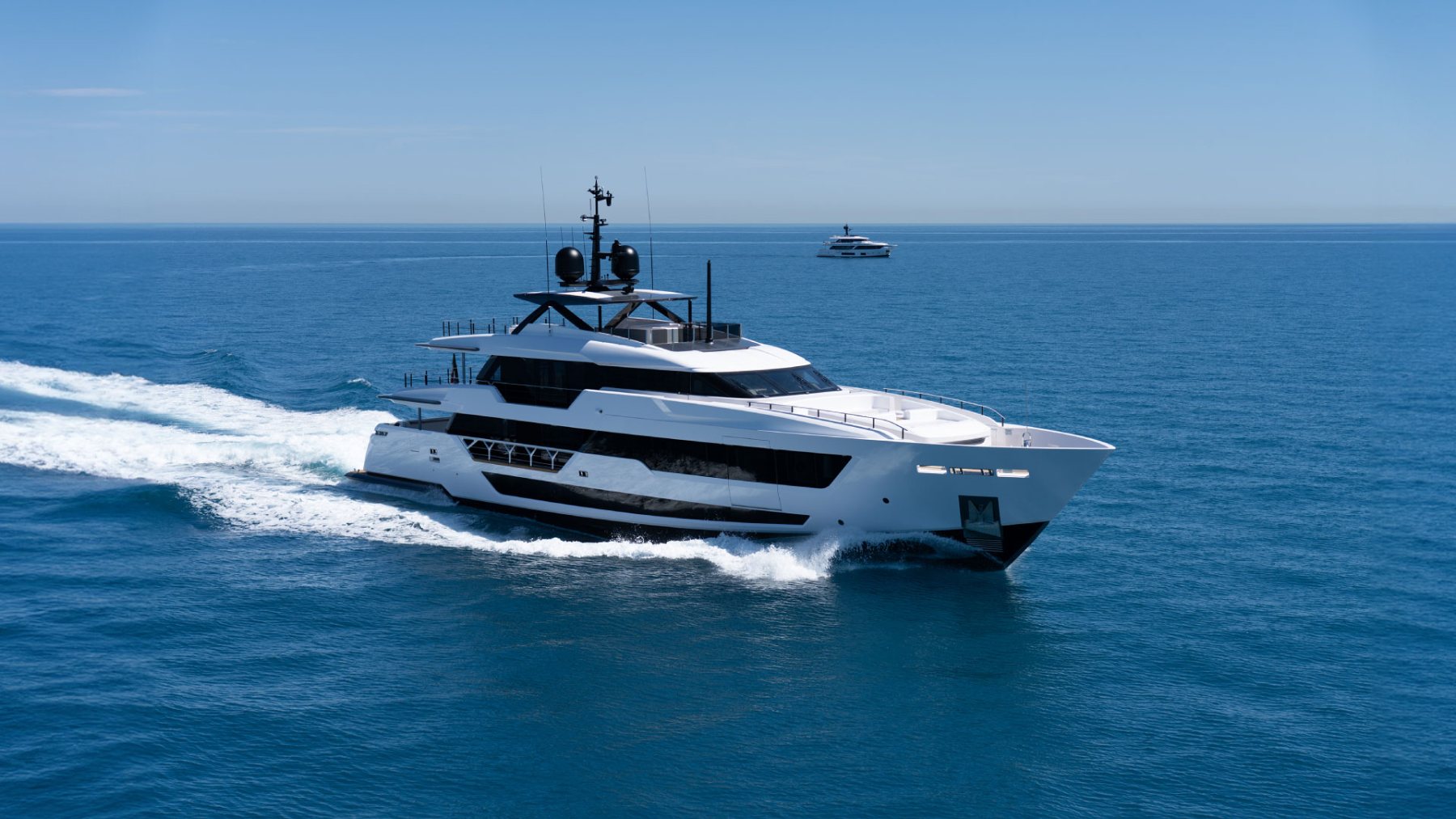 A superyacht underway on open water